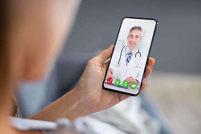 Telehealth doctor conducting an SDI evaluation for Tendonitis (Repetitive Strain Injury) in Downey, California